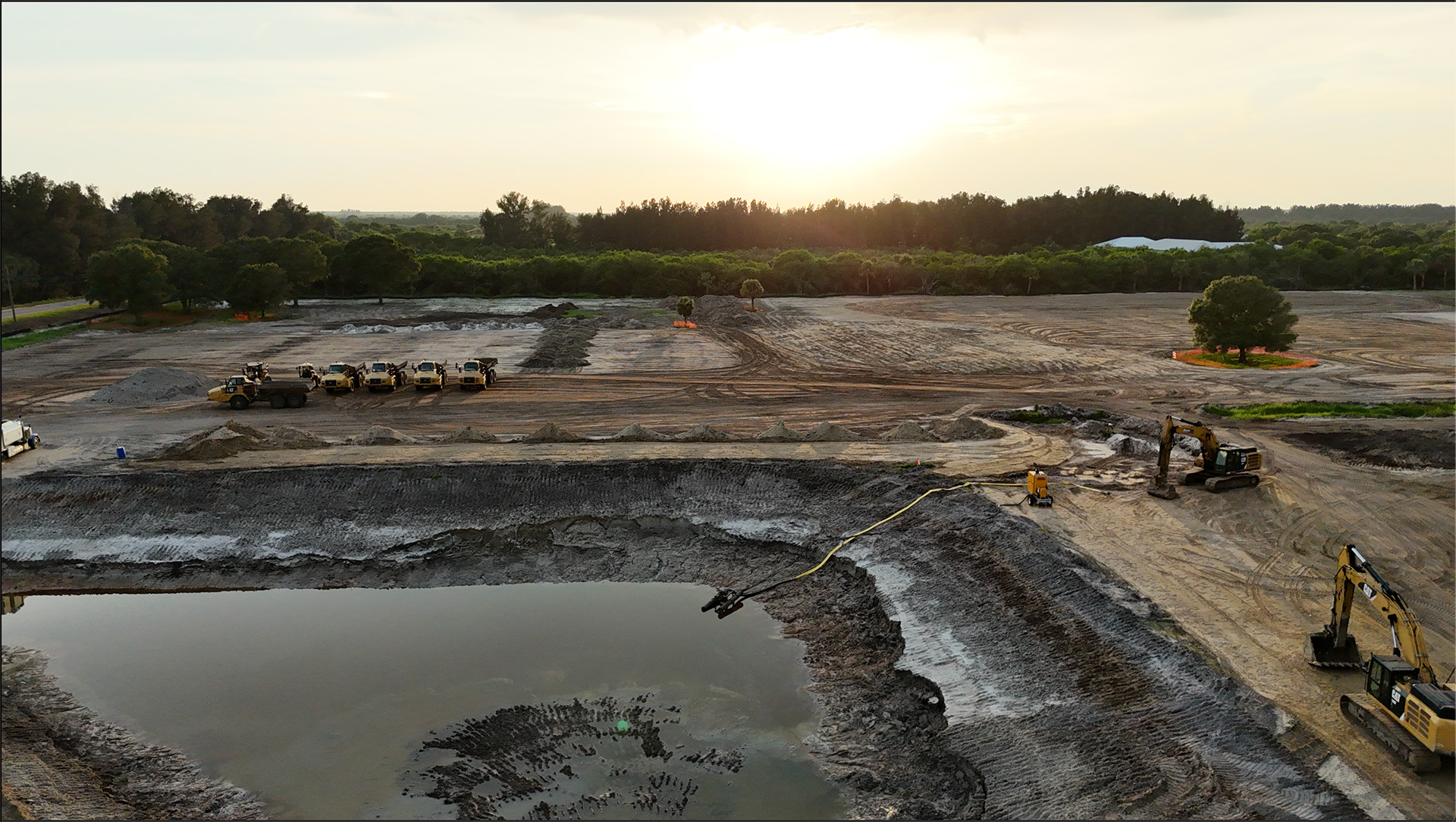 Excavation work on the lakes at sunset